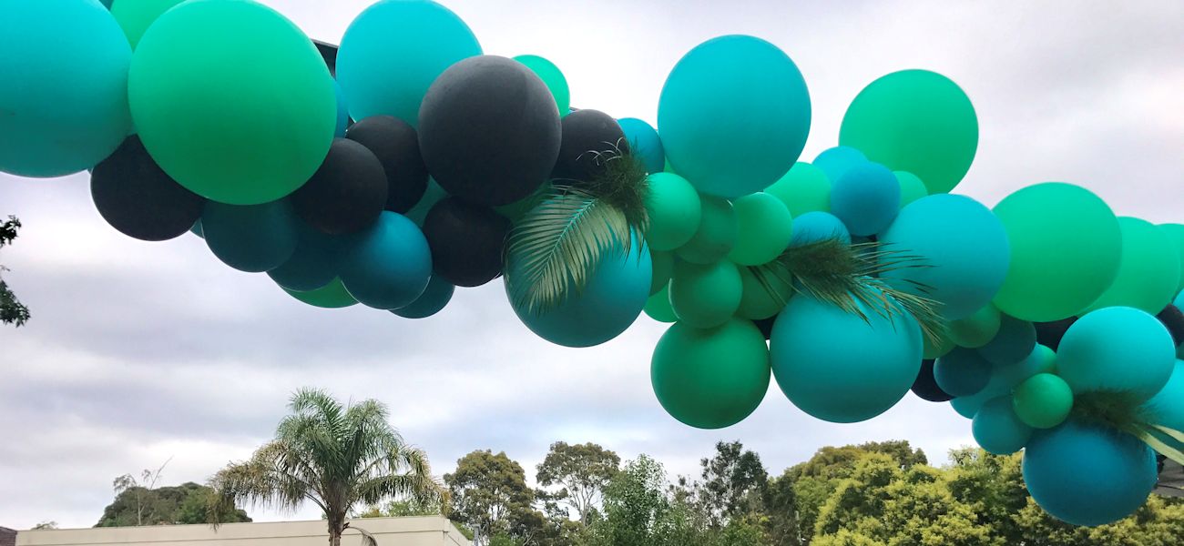 tropical pool party balloon sculptures